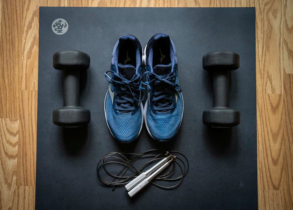 Dumbbells and training shoes — strength-focused wellness